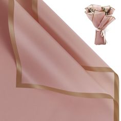 pink satin with gold border and flower brooch on white backgroung background