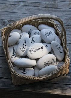 a basket filled with white rocks sitting on top of a wooden table