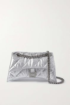 The gently curved silhouette of Balenciaga's 'Hourglass' bag is inspired by the house's '50s tailoring. Made from silver leather, this version is crinkled and quilted for softness and has an understated tonal strap that can be doubled up for a shorter drop. Luxury Quilted Party Bag, Elegant Quilted Party Bag, Heeled Rain Boots, Balenciaga Women, High Heel Rain Boots, Quilted Shoulder Bag, Metallic Bag, Balenciaga Bag, Backpack Tote Bag