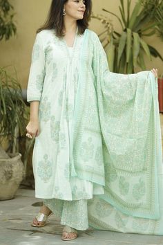 This beautiful  Handblock Kurta suit  set with Dupatta is the most comfortable and classy Indian outfit. Soothing pastel green color cotton fabric in this Jaipuri block print makes it very elegant. The pants a comfort fit with elastic band that makes the pants roomy. 3/4th sleeves and A line kurta with pockets  make it comfortable to wear for long hours , can be accessorised and worn at occasions . Specially handmade with love for you by the local Artisans of Jaipur , Rajasthan , India !  Size c Pastel Green Salwar Suit, Hand Block Printed Suits, Block Printed Suits, Indian Salwar Kameez, A Line Kurta, Business Formal, Kurta With Pants, Indian Outfit, Indian Cotton