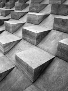 black and white photograph of concrete blocks arranged in the shape of rectangles on top of each other