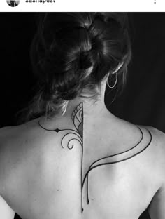 a woman with a tattoo on her back