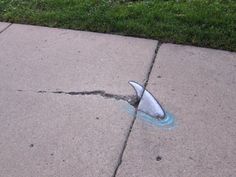 a broken fire hydrant sitting on top of a sidewalk