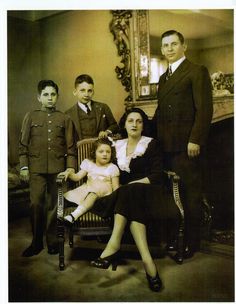 an old photo of a family posing for a picture