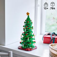 a christmas tree made out of legos on a window sill