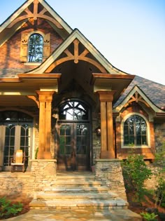 a house with stone steps leading up to the front door