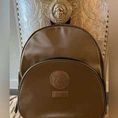 Never Used, Excellent Condition, Versace Backpack From Versace Parfums, Measures 12”X 12”X 6” Lining Repeats Versace. Front & Inside Zipper Pockets & Pockets Inside Versace Bags Women, Versace Palazzo Empire Bag, Versace Backpack, Versace Shopping Bag, Versace Small Backpack, Versace Crossbody Bags, Inside Pocket, Zipper Pocket, Versace