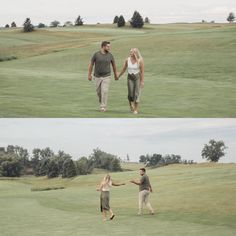 two people holding hands and walking across a golf course with trees in the back ground