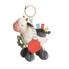 a stuffed cow hanging from a key chain