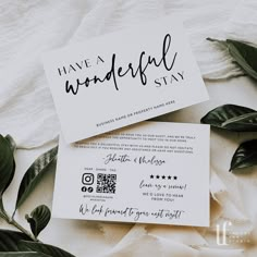 two cards with the words have a wonderful stay written on them next to some leaves