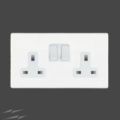 an electrical outlet with two white outlets