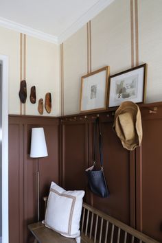 Two Toned Board And Batten Wall, Mid Century Wainscoting, Pattern On Pattern Interior Design, Partial Painted Wall, Small Entryway Wallpaper, Dark Board And Batten Wall, Hallway With Wallpaper, Wallpaper With Board And Batten, Brown Wainscoting