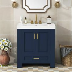 a bathroom vanity with a mirror above it and flowers in a vase next to it