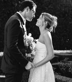 a bride and groom looking at each other