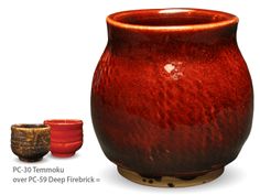 a red vase sitting next to two small bowls on top of a wooden stand with the words, pc 30 temoku over it's deep fire brick