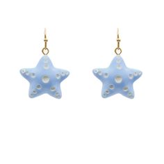 Starfish Clay Dangle Earrings: * Metal Accents * Crafted From Clay * Fish Hook Fastening * 0.75" Length Beach Star Charm Earrings, Blue Dangle Earrings With Ocean-inspired Style, Beach Earrings With Star Charm, Star-shaped Earrings With Star Charm For Beach, Star Shaped Earrings With Star Charm For Beach, Ocean-inspired Blue Dangle Earrings, Blue Starfish Charm Jewelry For Summer, Blue Star Charm Dangle Earrings, Blue Star Earrings With Star Charm