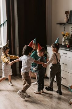 children in party hats playing with each other