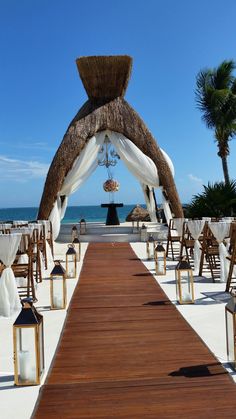 an outdoor wedding set up on the beach