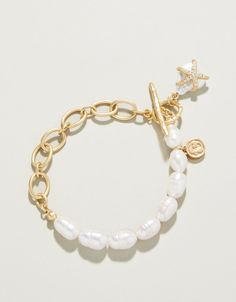 Are you a starfish groupie Make a splash with this freshwater pearl toggle bracelet featuring a sparkling starfish clinging to a faux pearl. Inspired by a tropical vacation, you'll reach for this Starfish Groupie Toggle Bracelet over and over again. Spartina 449 Jewelry, Things To Buy For Vacation, Costal Granddaughter Jewelry, Coastal Granddaughter Jewelry, Vacation Bracelets, Gold And Pearl Jewelry, Vacation Outfit Inspiration, Inspirational Clothing, Coastal Jewelry