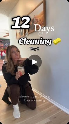 a woman sitting on the floor with a cup in her hand and text that reads, 12 days of cleaning day 2