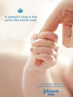 a person holding the hand of a baby's hand in front of a white background