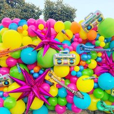 a bunch of balloons that are all over the ground with some items on top of them