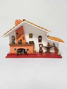 a miniature model of a house with furniture