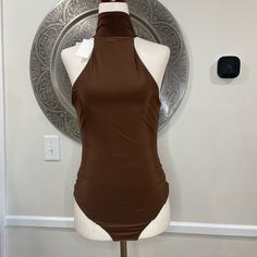 Wayf Brown Turtle Neck Sleeveless Body Suit- Size M Length: 30” Underarm To Underarm: 15” Materials: 96% Polyester, 4% Spandex Chic Fitted Sleeveless Vest, Brown Fitted Cami Tank Top, Brown Stretch Tank Top For Night Out, Chic Fitted Tank Vest, Stretch Brown Tank Top For Night Out, Brown Sleeveless Stretch Halter Top, Brown Stretch Halter Neck Tank Top, Brown Stretch Sleeveless Tank Top, Fitted Sleeveless Tank Top For Night Out