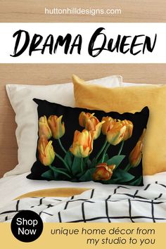 a bed with yellow flowers on it and the words dream queen written in black ink