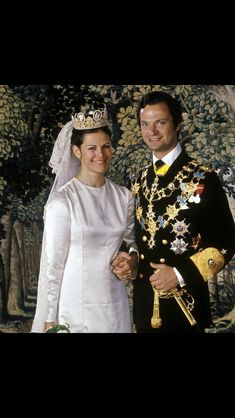 a bride and groom standing next to each other