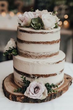 a three tiered cake with flowers on the top is displayed in an instagram