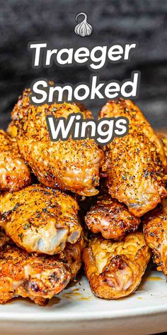 grilled chicken wings on a white plate with text overlay that reads, traeger smoked wings