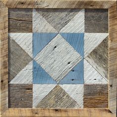 an old wooden frame with blue and white squares