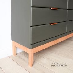 a close up of a dresser on a wooden floor