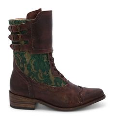 a pair of brown boots with green lace on them