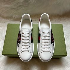 New In Box. Gucci Ace Snake Sneakers. White Leather With Red Leather Detail On The Heel Of One Shoe And Green On The Other Green And Red Web Thread Embroidered Snake Leather Lining Rubber Sole Flat .6" Height Made In Italy Embroidered Snake, Gucci Ace Sneakers, Red Web, Snake Leather, Leather Detail, Green And Red, Sneakers White, White Leather, Red Leather