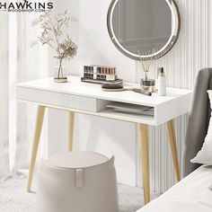 a white desk with a round mirror on it