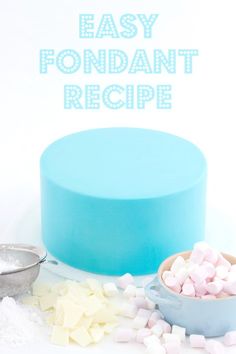 a blue cake with marshmallows on it and the words easy fondant recipe