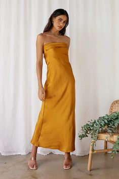 Chic Gold Maxi Dress For Date Night, Chic Gold Maxi Length Dress, Chic Gold Maxi Dress, Chic Long Gold Maxi Dress, Gold Strapless Dress For Date Night, Chic Gold Maxi Dress For Summer, Gold Maxi Dress For Formal Summer Occasions, Gold Midi Dress For Prom Party Season, Gold Midi Dress For Prom And Party Season