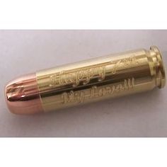 a close up view of the inside of a gold colored lip bale with writing on it