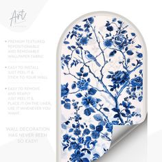 a blue and white wall hanging with flowers on it, next to an advertise