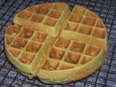 two waffles sitting on top of a metal grate next to each other