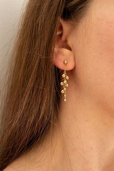 Completely handcrafted in our New York studio, the Gold Dust Petite Earrings are composed of Sterling Silver signature clustering.  Lightweight and easy to wear. Ear wires: posts Materials: 14k Gold Filled or Sterling Silver Measures approx. 1 1/4" in length Handmade in New York Arrives perfectly packaged, ready for gi Gold Cluster Earrings In 14k, Dainty Gold Plated Bridal Earrings, Delicate Yellow Gold Drop Earrings, Delicate Hypoallergenic Gold Plated Earrings, Dainty Yellow Gold Plated Earrings, Gold 14k Gold-filled Dangle Bridal Earrings, Petite Earrings, New York Studio, Gold Dust