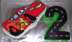 the birthday cake is made to look like a race car and number two on it