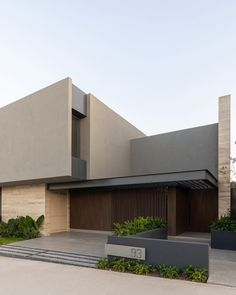 a modern house with an entry way leading to it