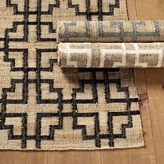 two rugs are laying on the floor next to each other and one is black and white