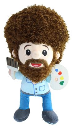 a stuffed toy with a beard holding a paintbrush