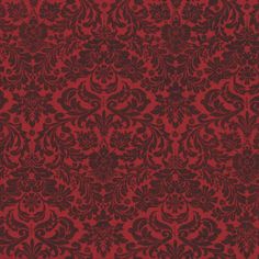 a red and black wallpaper with an ornate design