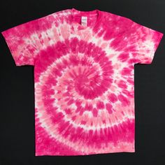 a pink and white tie - dyed t - shirt on a black background