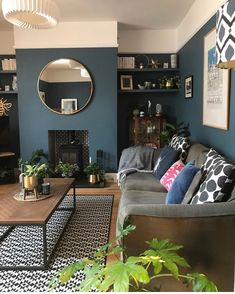 a living room filled with furniture and a fire place